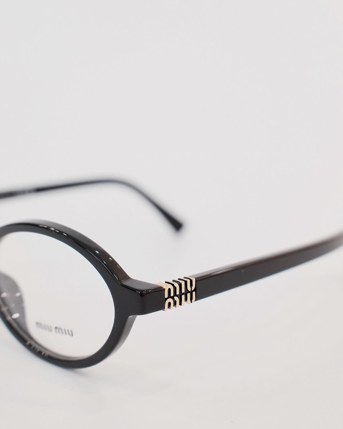 Miu Miu Oval Black Transparent T-1